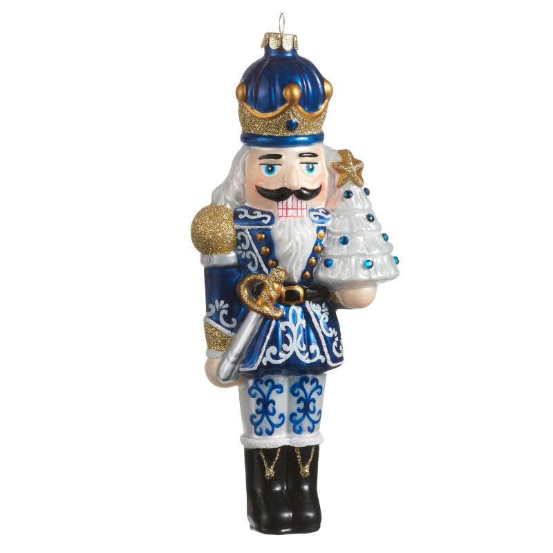 8.25-inch blue and white glass Chinoiserie nutcracker ornament holding a white Christmas tree.