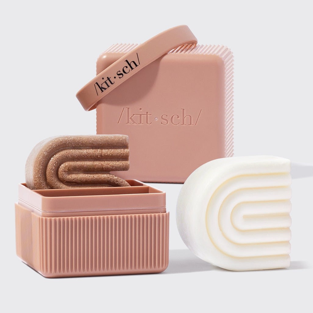 Pink Bottle-Free Beauty Travel Case with two shampoo and conditioner bars and a silicone band.