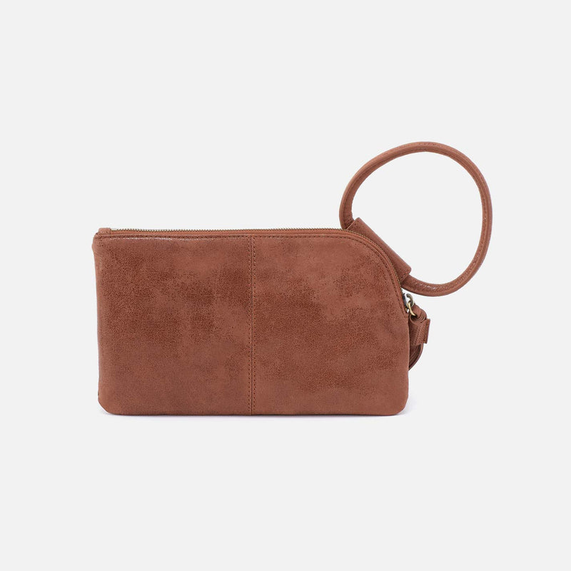 Sable wristlet in burnished saddle leather with brass hardware
