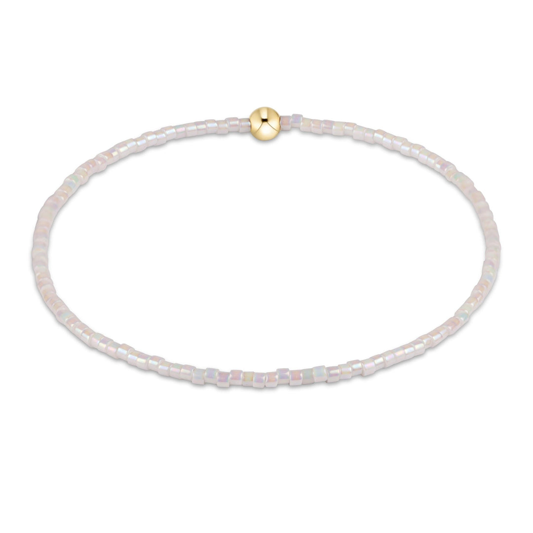 Egirl Hope Classic bracelet featuring a gold-filled bead with black seed beads on stretch elastic.