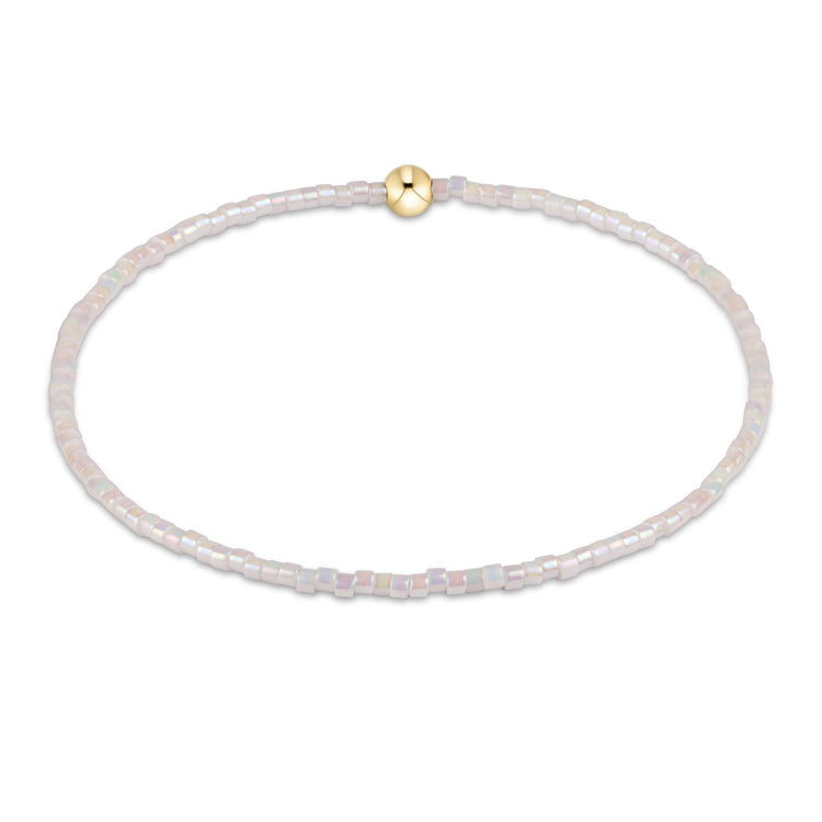 Egirl Hope Classic bracelet featuring a gold-filled bead with black seed beads on stretch elastic.