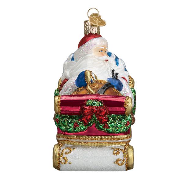 Glass Santa in Sleigh ornament with red, green, and gold glitter accents.