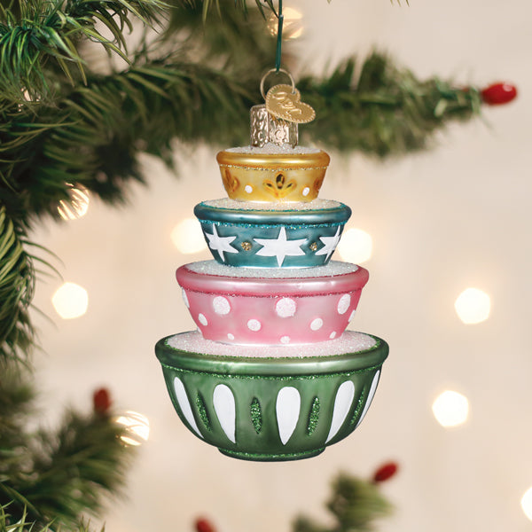 Stacked ceramic mixing bowl ornaments in cheerful colors with a glossy finish.