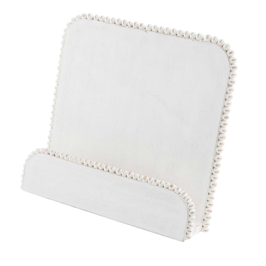 Square white beaded cookbook holder made from mango wood with a natural grain pattern.