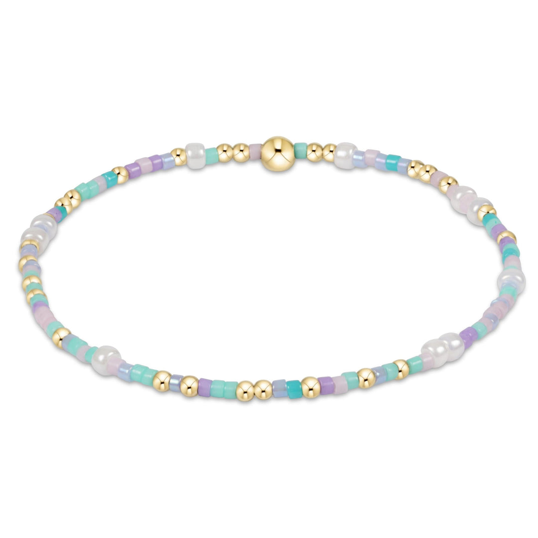 Egirl Hope Unwritten bracelet featuring 14kt gold-filled beads with colorful seed bead accents on stretch elastic.