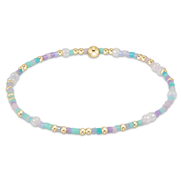 Egirl Hope Unwritten bracelet featuring 14kt gold-filled beads with colorful seed bead accents on stretch elastic.