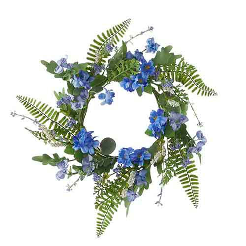 Mini floral wreath candle ring with fern leaves in green polyester foam holding a pillar candle.