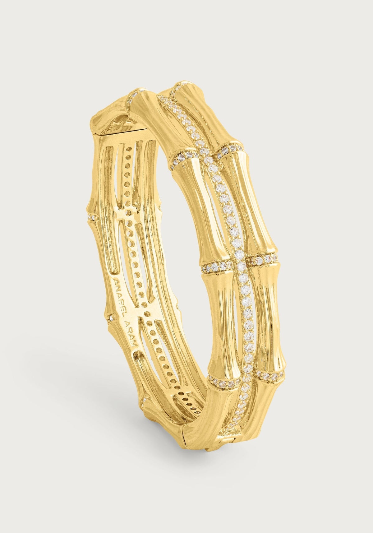 Gold-plated bamboo stacked hinged bangle with crystal pavé accents.