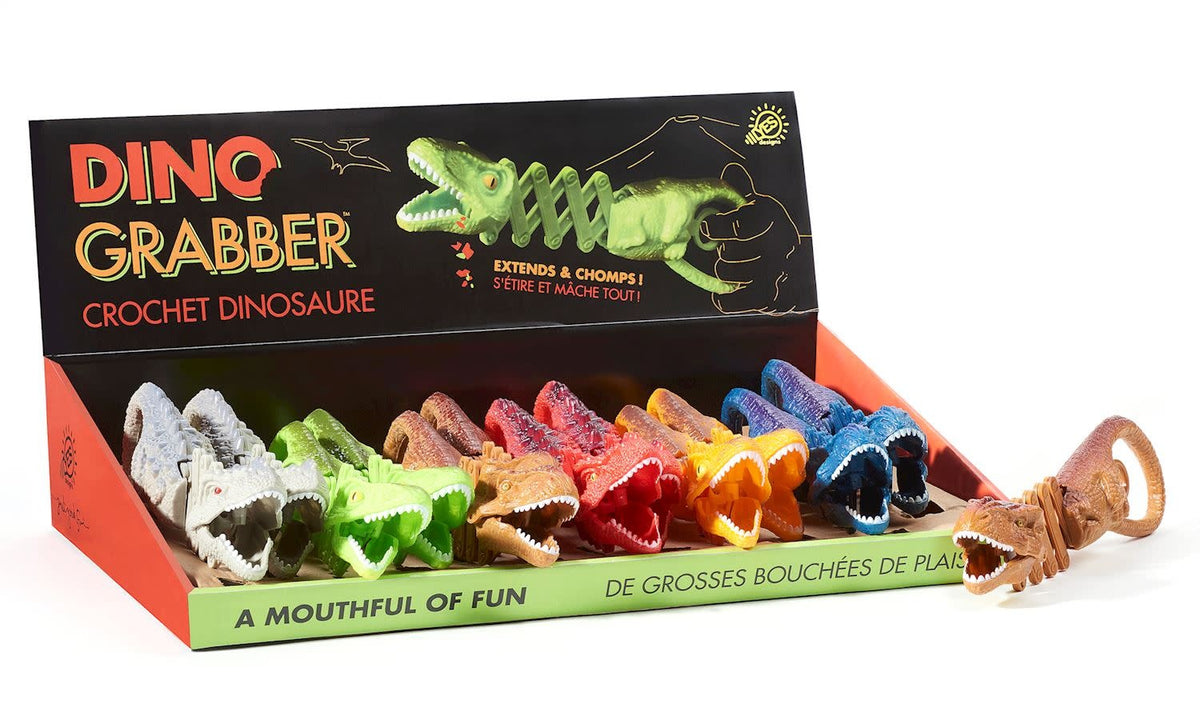 Green plastic dinosaur toy with an open mouth designed to grab small objects.