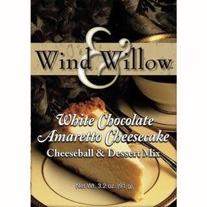 Creamy white chocolate amaretto cheeseball rolled in sliced almonds