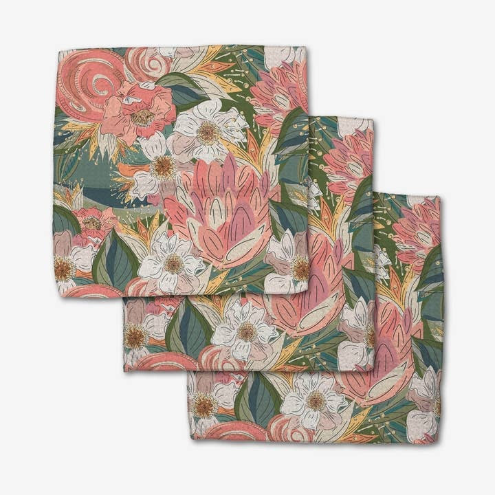 Set of three waffle weave dishcloths with single-sided flower explosion print in recycled polyester.