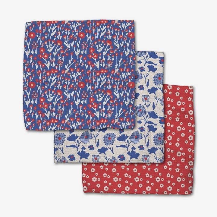 Set of three royal blue waffle weave dishcloths with hang loops made from recycled polyester.