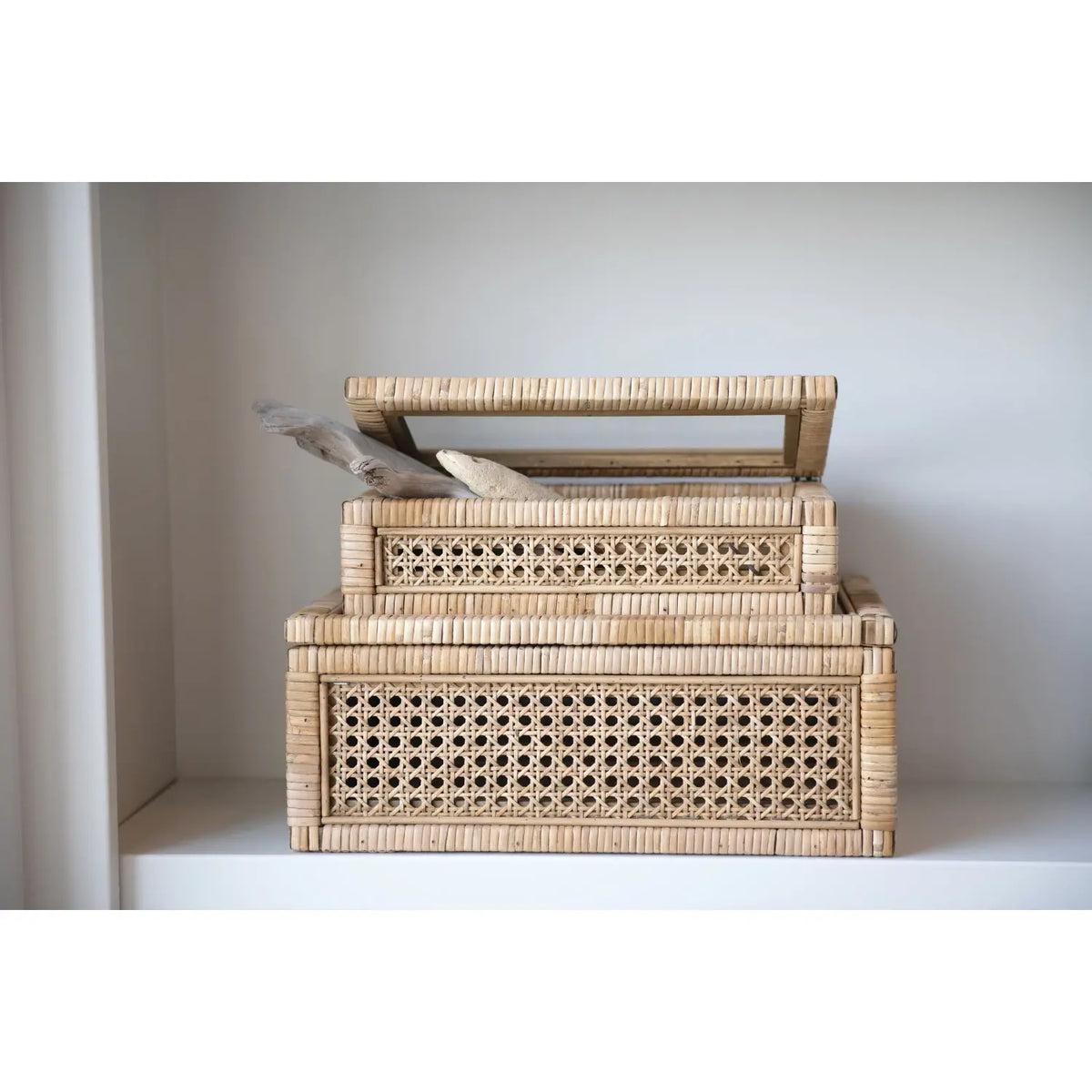 Rattan display box with clear glass lid showing contents
