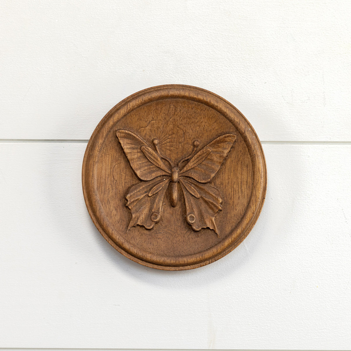 Wood wall plaque featuring a simple rectangular shape with natural grain texture.
