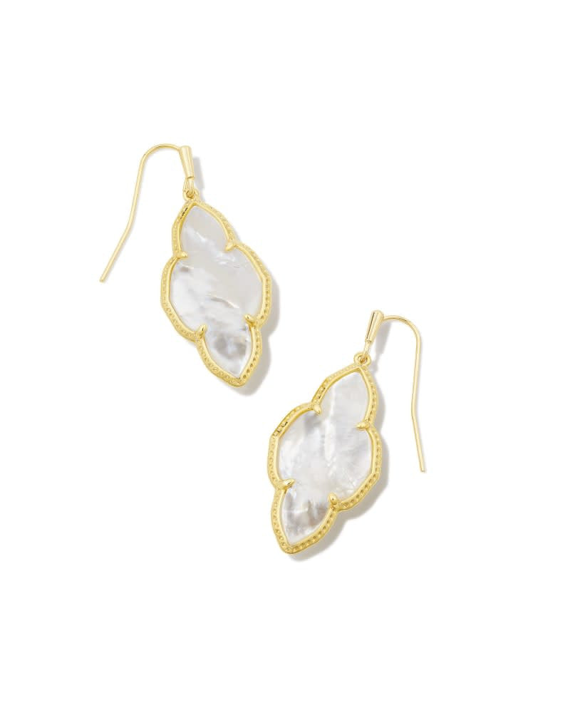 Abbie Drop Earrings in gold with an elongated white medallion and earwire closure.