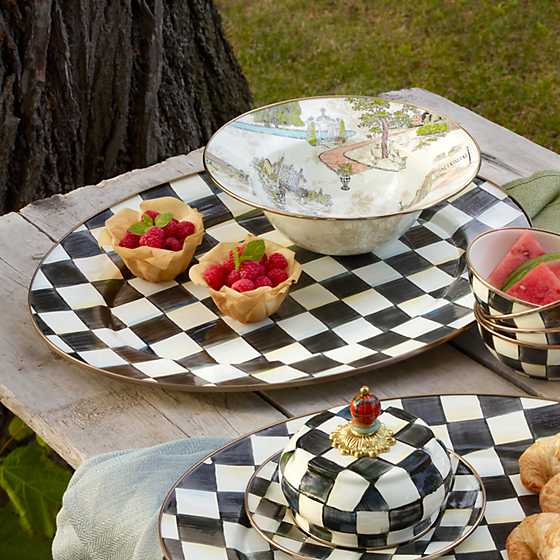 Large oval platter with hand-painted black and white Courtly Checks and bronzed stainless steel rim.