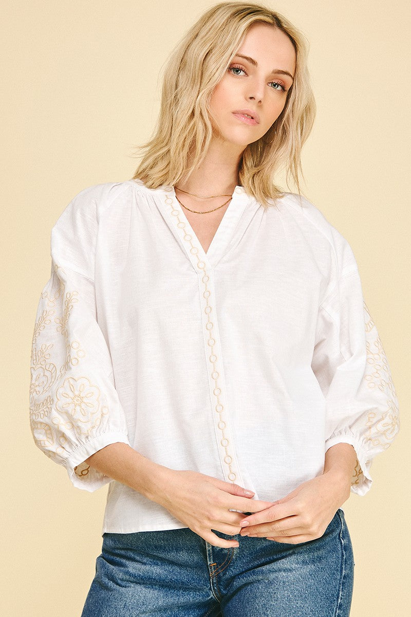 Women's Florence floral embroidered blouse in light blue cotton linen blend with relaxed silhouette.