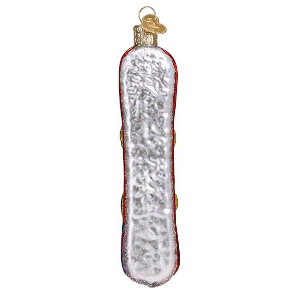 Glittery white and red snowboard glass Christmas ornament with a gold heart-shaped charm.