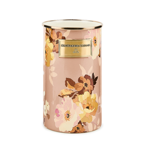 Cylindrical utensil holder with a pink floral pattern and a gold Mackenzie-Childs logo plate.