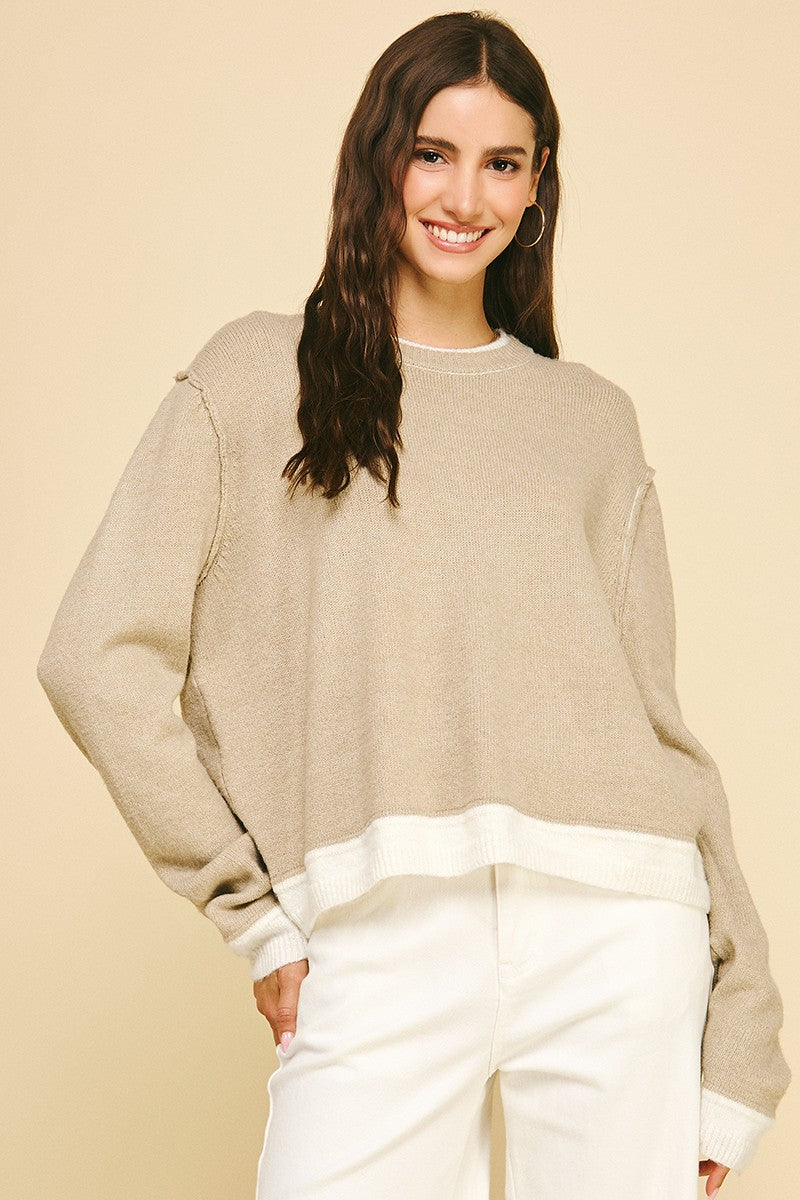 Mia Colorblock knit sweater in polyester with drop-shoulder sleeves and raw edge detailing.