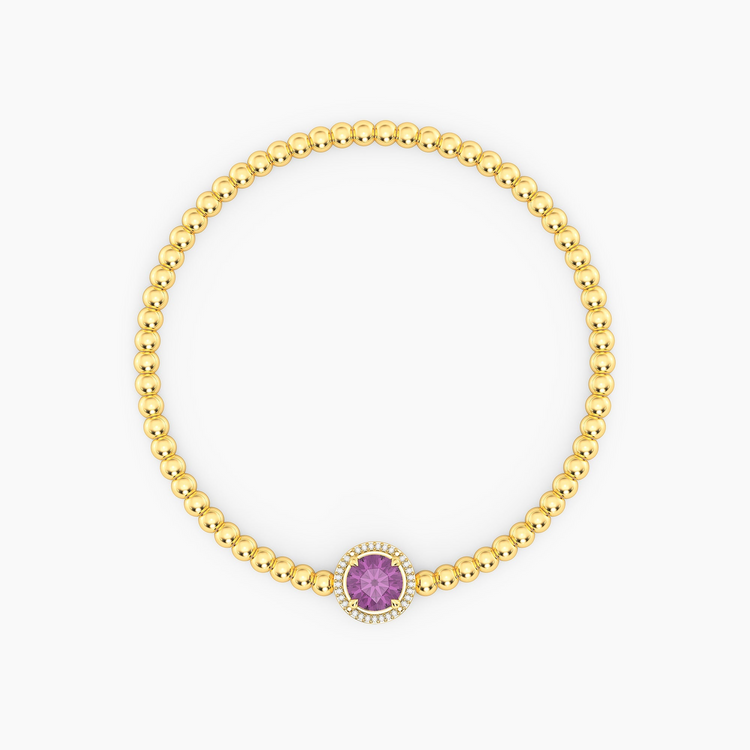 Gold-plated beaded bracelet with a round purple birthstone charm and diamond halo.