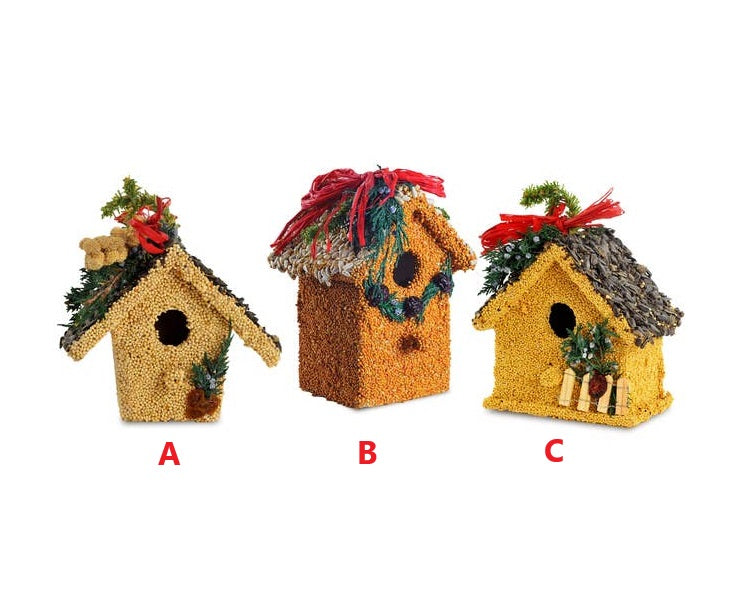 Hand-decorated wooden birdhouse with red raffia, juniper, cranberries, and millet.