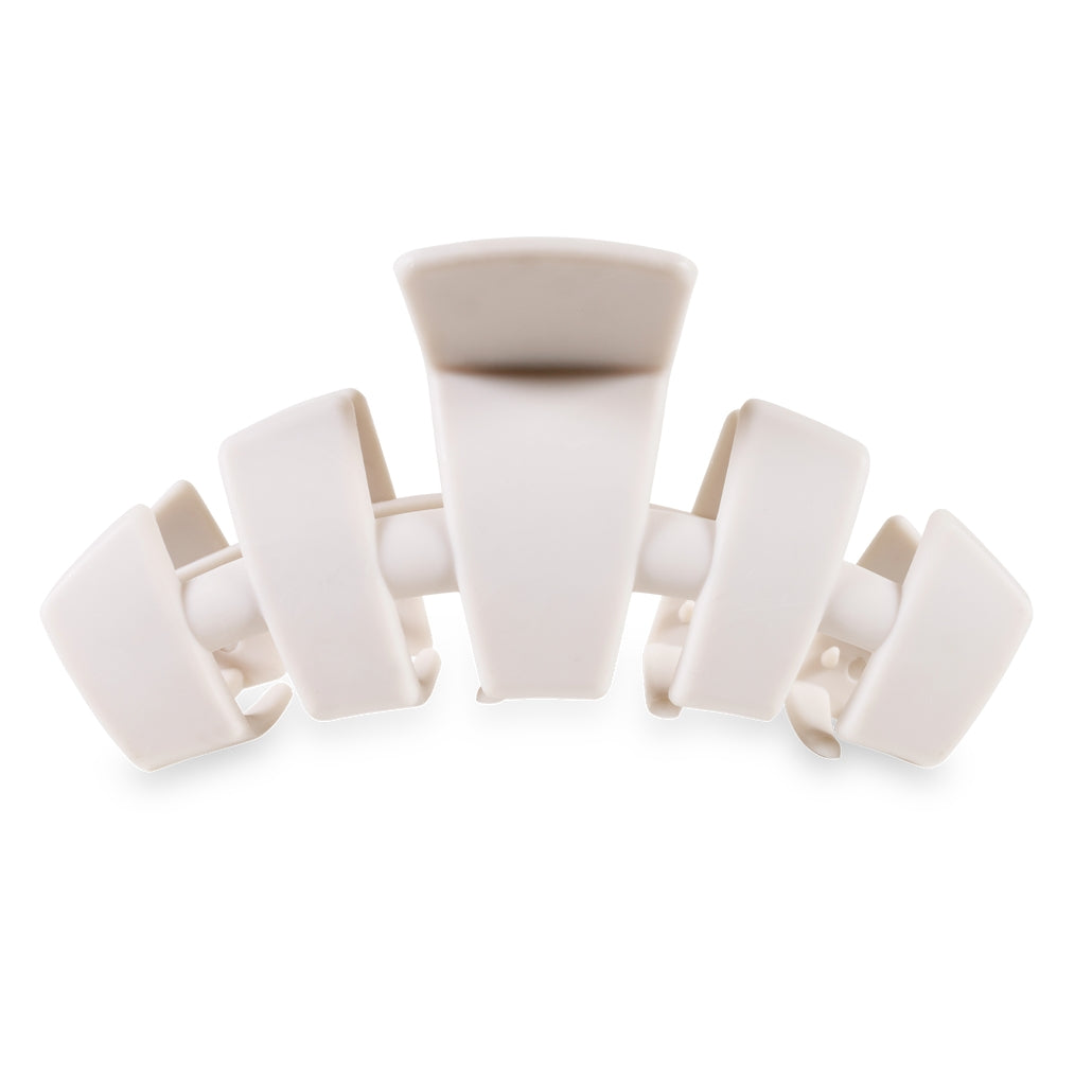 Large classic hair clip with bendable teeth in a neutral tone.