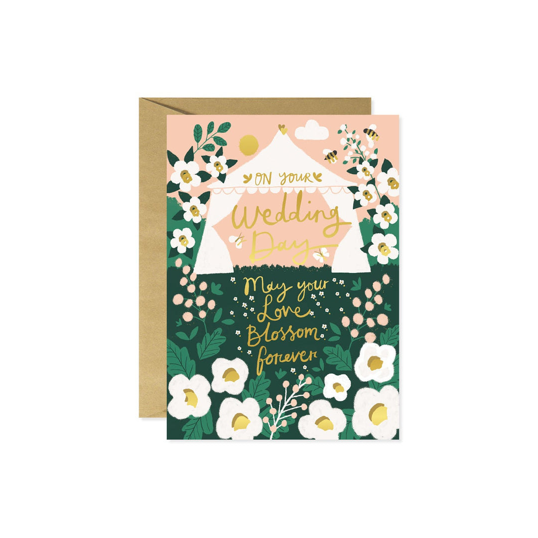 Backyard Wedding Tent card with floral accents featuring text 'On Your Wedding Day May your love blossom forever' on the front.