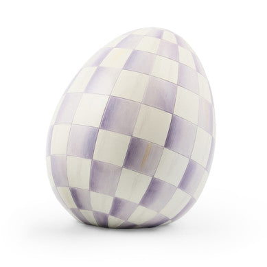 Small resin egg sculpture with a speckled natural finish.
