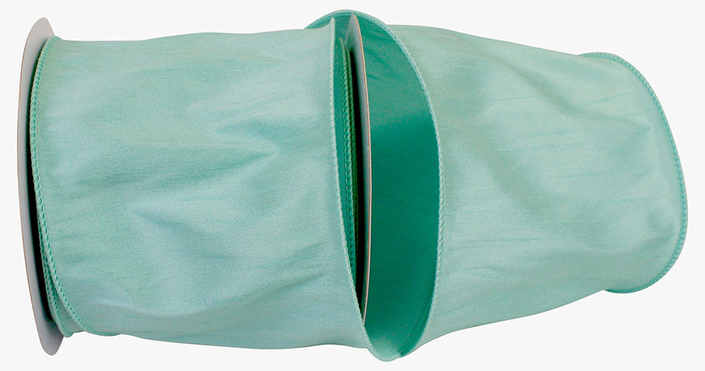 Mint green Dupioni Supreme wired edge ribbon on a roll with a faux silk texture.