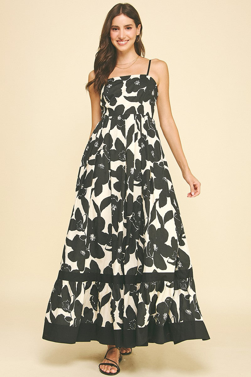 Maxine Floral Tiered Maxi Dress in black and white cotton with spaghetti straps and a ruffled hem.