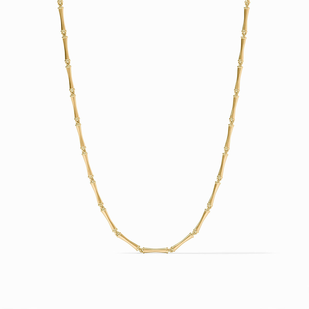 Gold necklace featuring a chain of bamboo-shaped links with a polished finish.