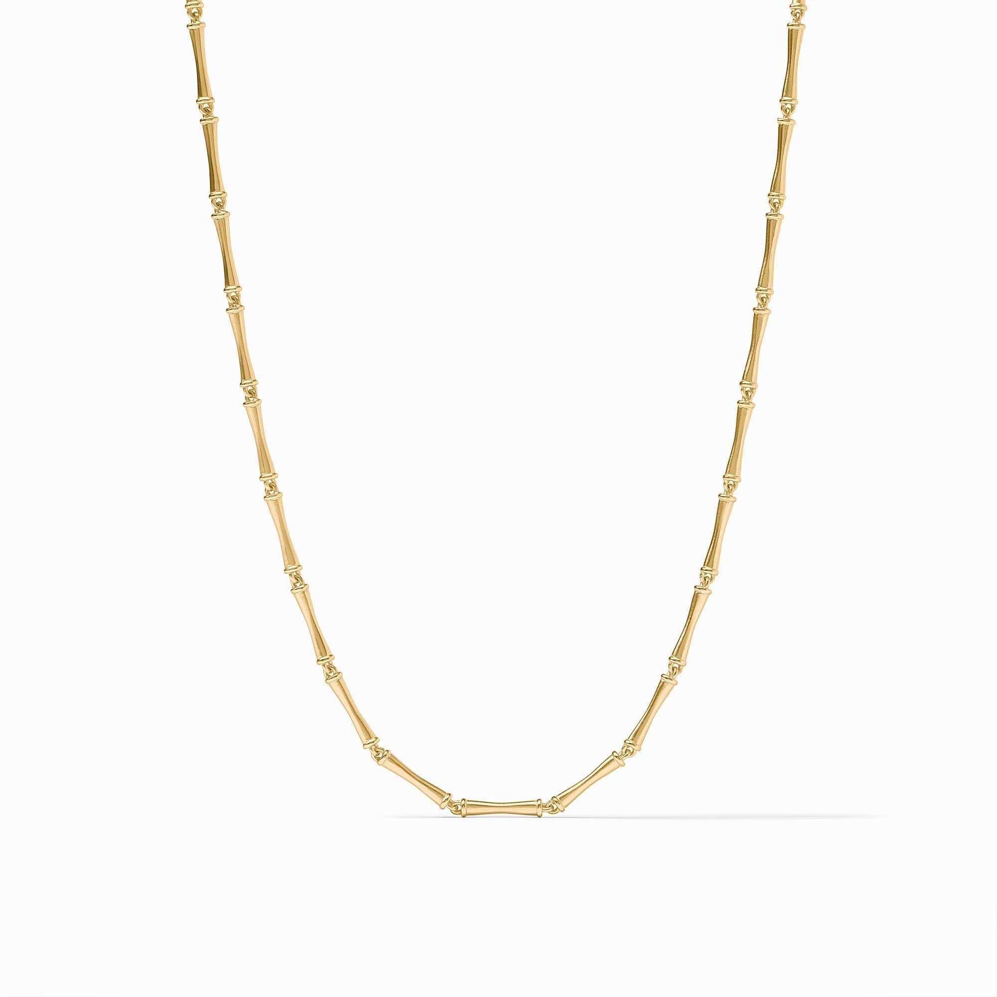Gold necklace featuring a chain of bamboo-shaped links with a polished finish.
