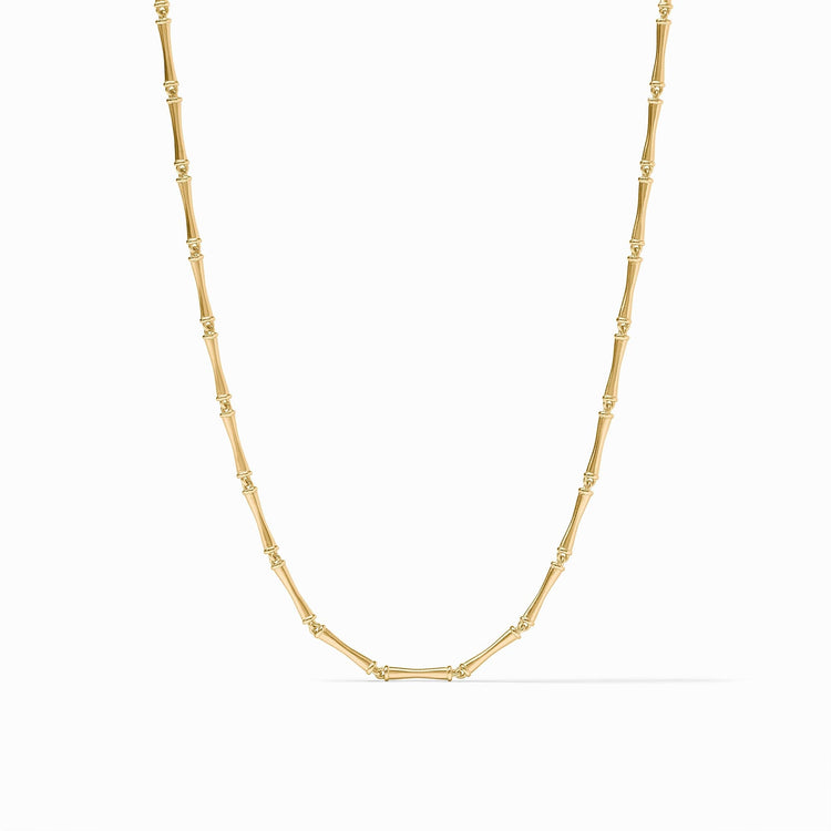 Gold necklace featuring a chain of bamboo-shaped links with a polished finish.