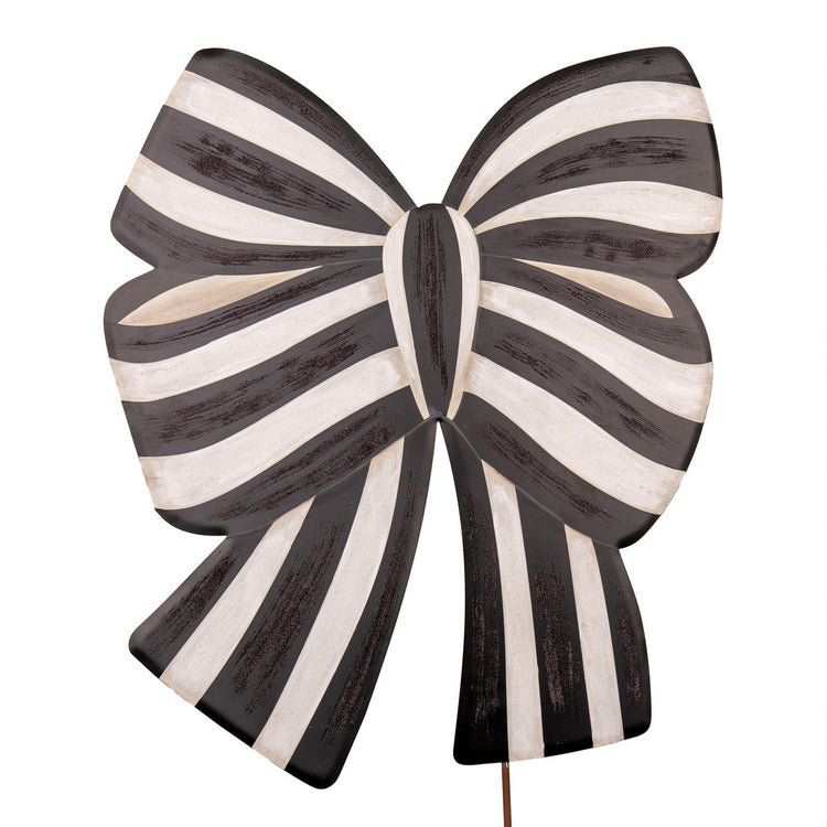 Elegant Bow Yard stake with a natural wood finish featuring an asymmetrical bow silhouette and metal hardware.