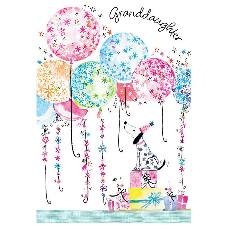 Foil balloon shaped like a Dalmatian dog with 'Happy Birthday' text inside the silhouette.