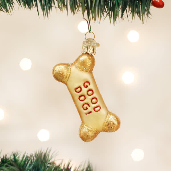 Dog Biscuit ornament shaped like a golden-brown dog biscuit with embossed paw print details.
