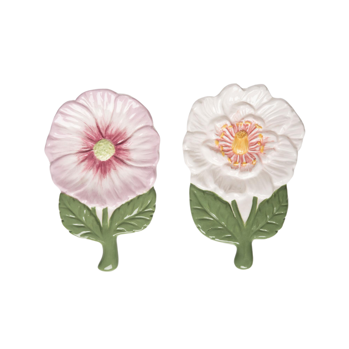 Ceramic spoon rest with floral and insect motifs in a garden party pattern.