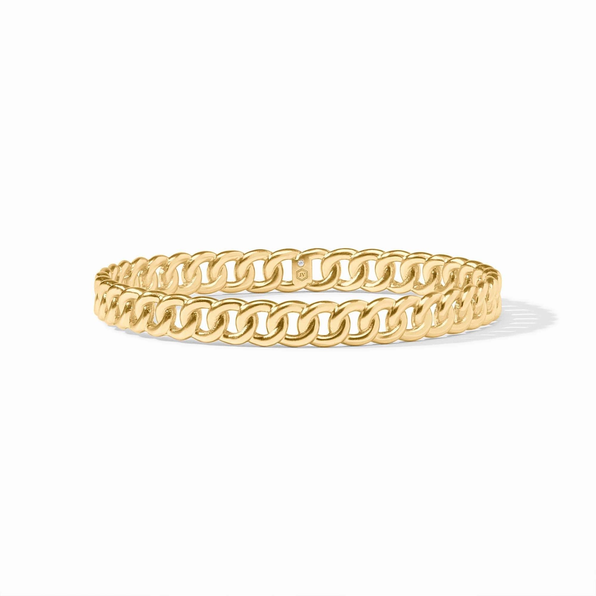 Gold-tone Dolce bangle bracelet with a smooth cylindrical shape.