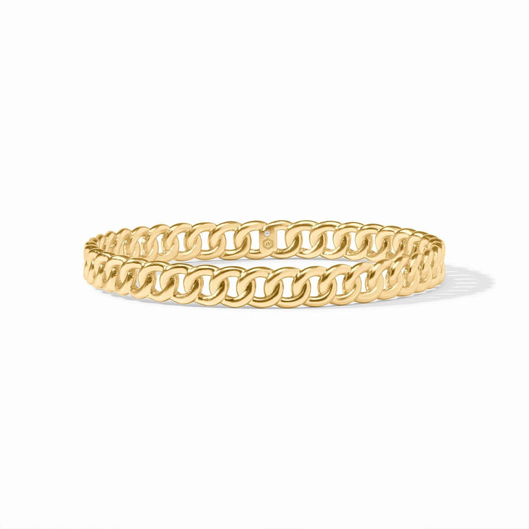 Gold-tone Dolce bangle bracelet with a smooth cylindrical shape.