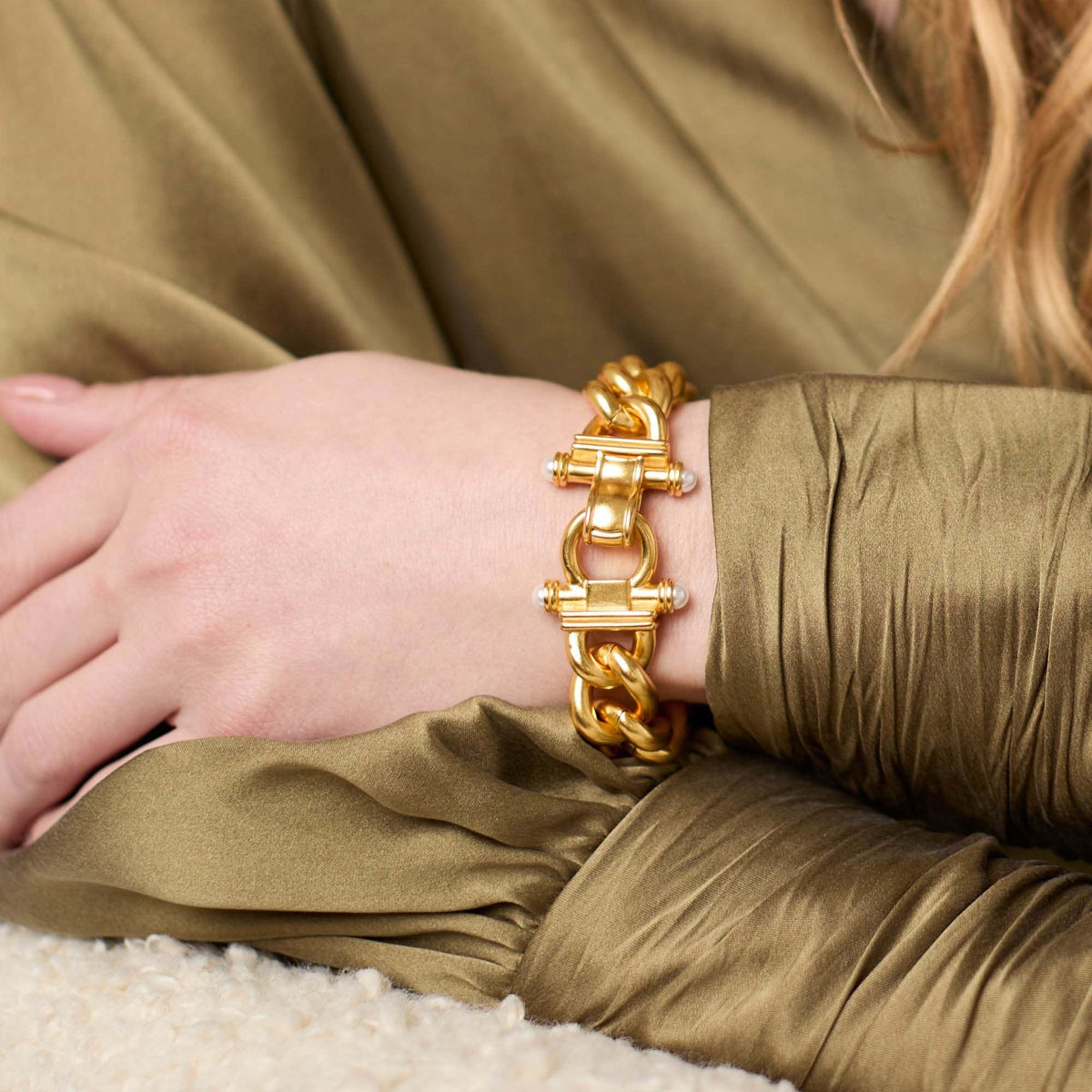 Dolce Link Bracelet in gold with glass pearl accents featuring chunky links and a fold-over clasp.