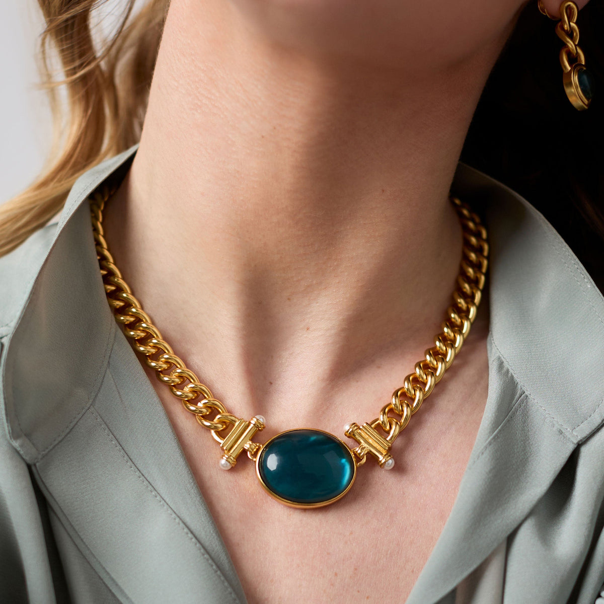 Adjustable gold-plated necklace with imported glass beads and a pearl accent.