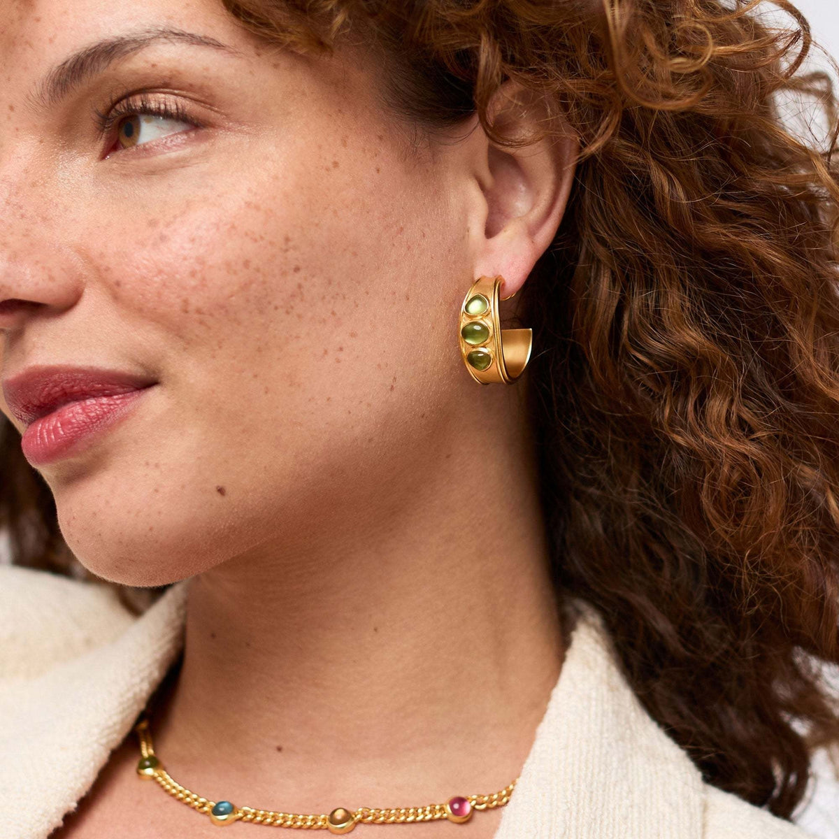 Gold-plated hoop earring with imported glass post featuring a sleek circular silhouette.