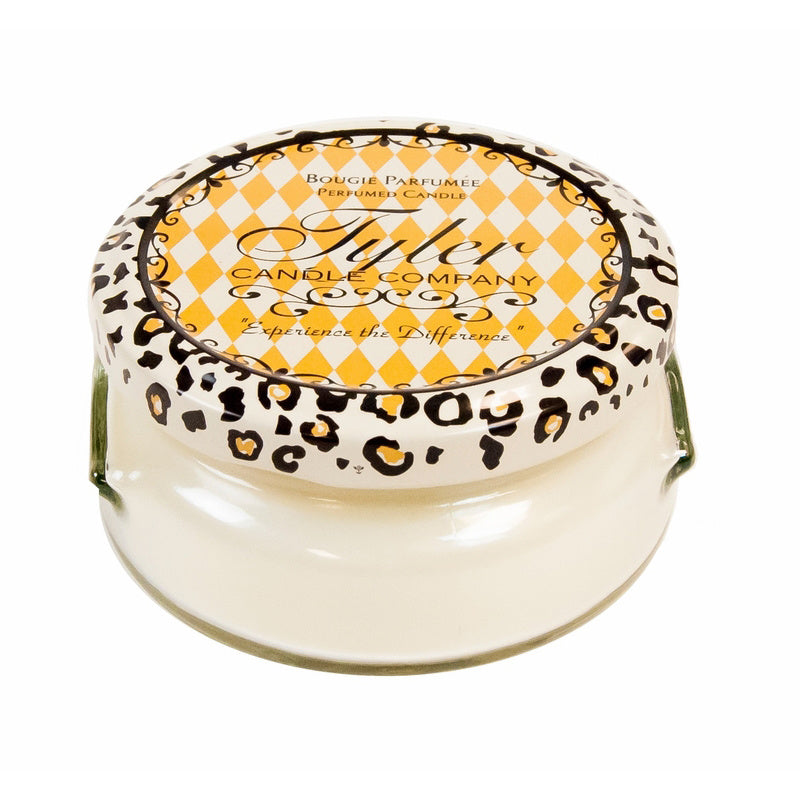 A 22oz Tyler Candle in a clear glass jar with an off-white wax and black wick.