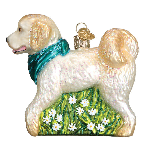 Side view of a Doodle Dog ornament made of white material with black curly fur pattern.