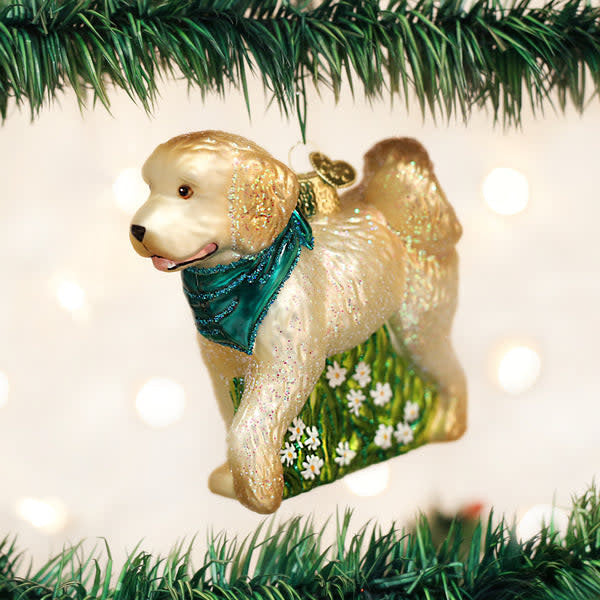 Red ceramic dog ornament shaped like a doodle with curly fur texture.