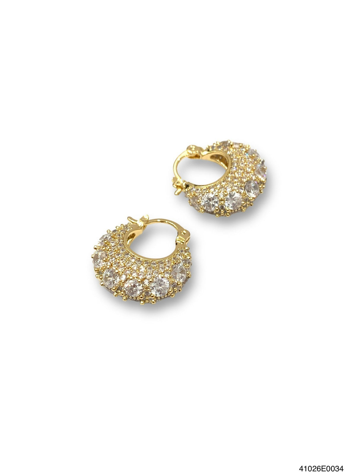 Gold CZ hoop earrings with a brass post on an off-white background.