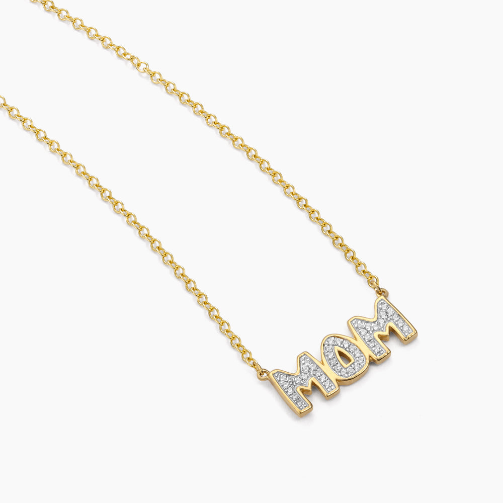 Gold chain necklace with a diamond-encrusted MOM pendant.