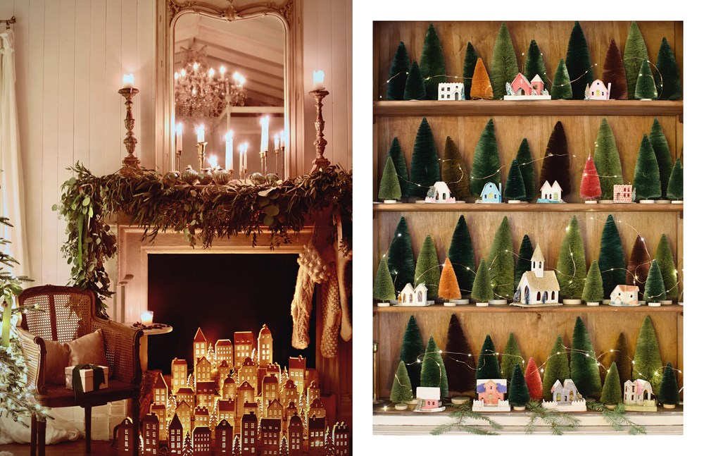 French country Christmas decor featuring a lit fireplace village and a shelf of bottle brush trees.