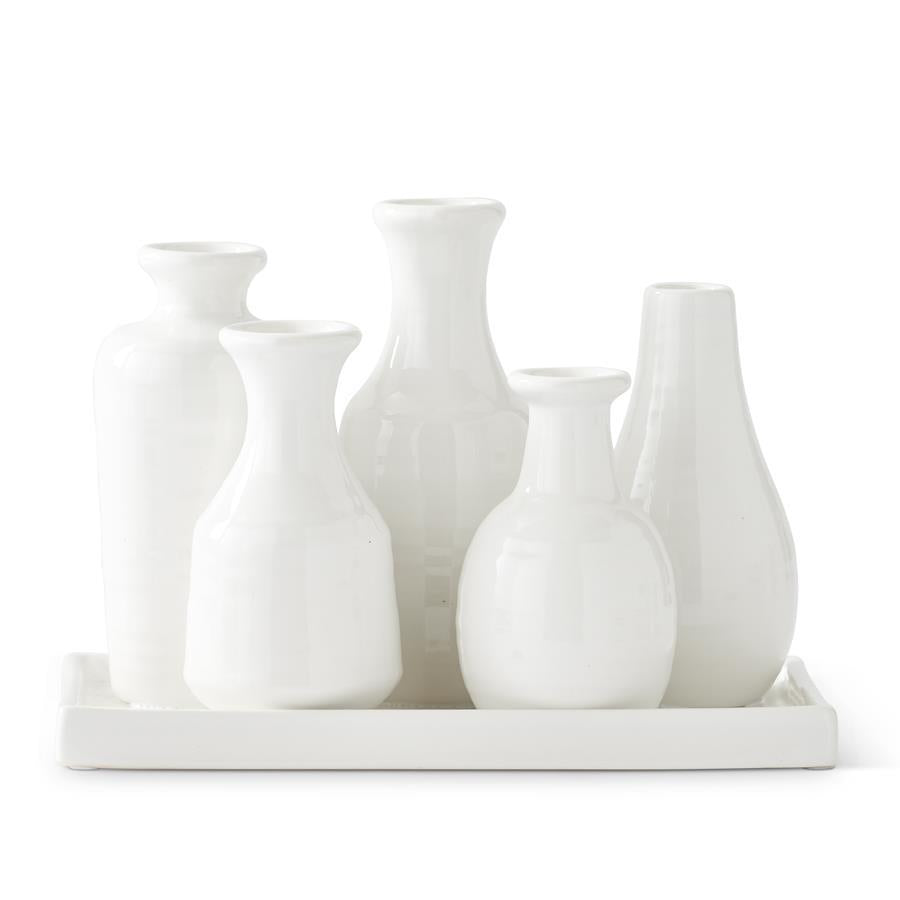 Set of five white ceramic vases with attached tray